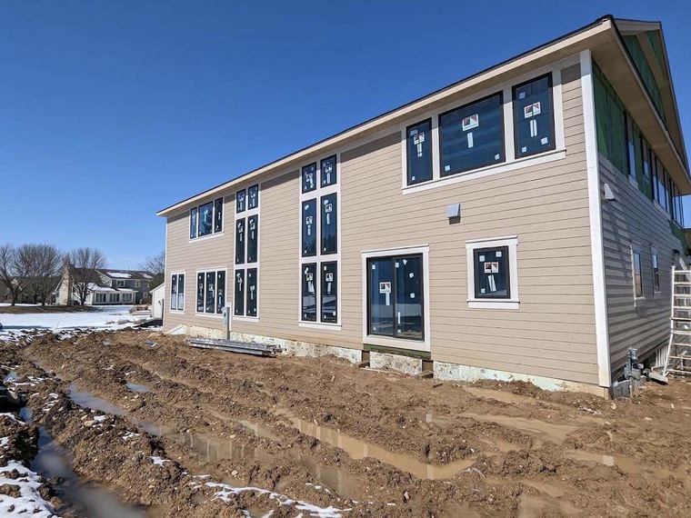 Siding installation in progress during winter
